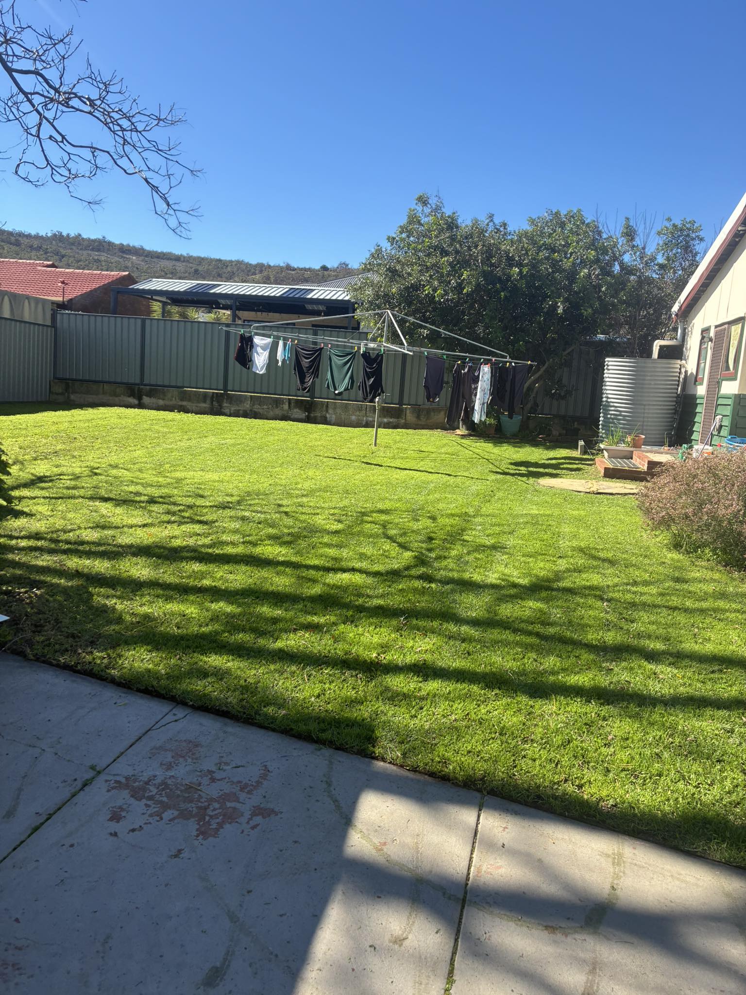 Recent lawn mowing job with grass cut and edged